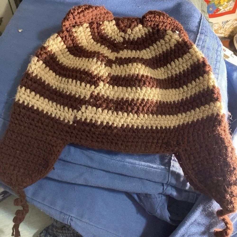 Crochet cat hat with ear flaps      New                 there’s a cat in my lap